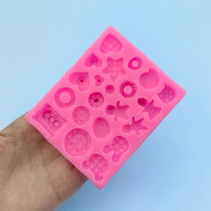 Pink silicone mold for mini cartoon cookies and DIY clay crafts with various cute shapes