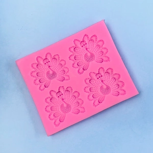 Detailed pink silicone peacock pattern mold for baking, fondant, and resin crafts