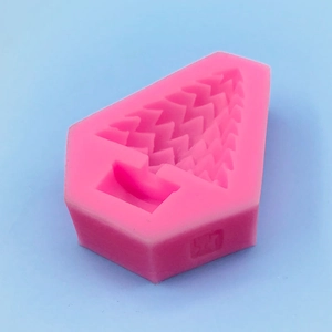 Pink silicone mold with Christmas tree design for cakes, chocolates, and baking crafts