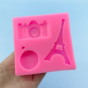 Pink silicone mold featuring Eiffel Tower and camera shapes for fondant and DIY baking