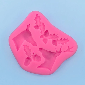 Detailed pink silicone mold featuring deer heads and pine cones for Christmas DIY crafts