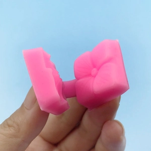 Pink silicone petal mold for fondant flower decorating and soap making textures