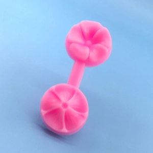 Detail view of pink silicone flower petal veiner mold for fondant baking decoration