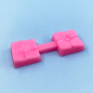 Pink double floral petal silicone mold for fondant and baking on a light blue background
