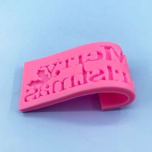 Pink silicone Merry Christmas letter mold for festive cake fondant and chocolate baking