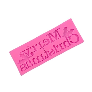 Pink silicone Merry Christmas mold with holly leaf patterns for festive baking and crafts