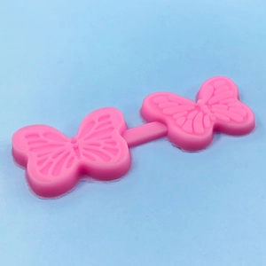 Pink butterfly silicone mold for DIY cake decorating and baking with detailed wing textures