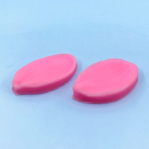 Macro view of pink lily leaf silicone molds for fondant and flower petal shaping