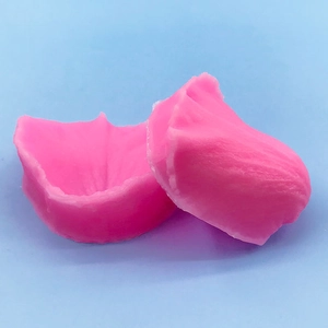 Pink silicone mold featuring circular leaf and petal textures for cake decorating and DIY