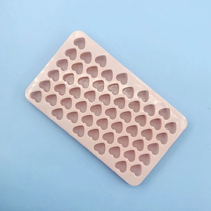Detailed top view of pink 55-cavity heart silicone mold for chocolate and fondant decor