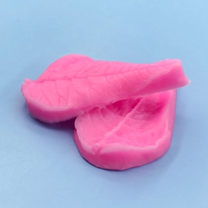 Pink silicone leaf mold with detailed vein textures for fondant cake and soap making