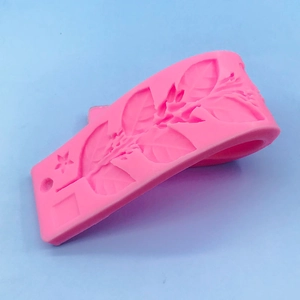 Pink silicone leaf vine mold for DIY cake decorating and fondant border design