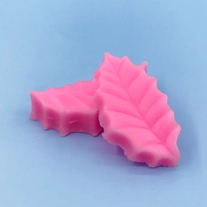 Pink leaf-shaped silicone fondant mold featuring detailed vein texture for cake baking