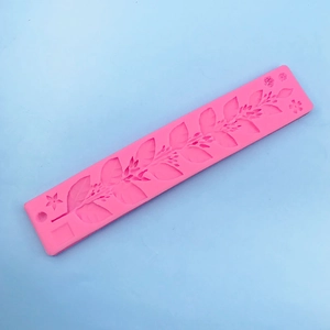Detailed macro view of pink silicone leaf and vine vine texture mold for cake fondant