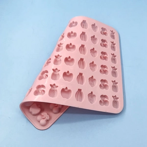 Pink fruit-shaped silicone mold for DIY candies, chocolates, and baking tools