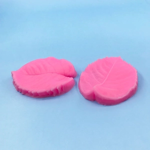 Detailed view of pink silicone leaf vein molds for fondant and pastry decorating