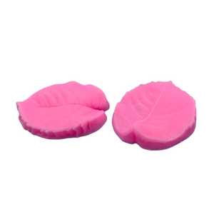Pink leaf-shaped silicone fondant mold set with detailed vein textures for cake decorating