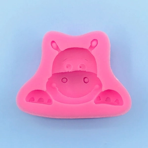 Macro shot of pink hippo-shaped silicone mold for cake fondant and chocolate crafting