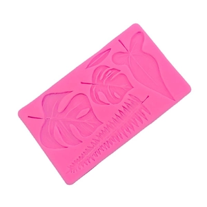 Leaf silicone mold for chocolate featuring monstera and palm patterns in pink finish