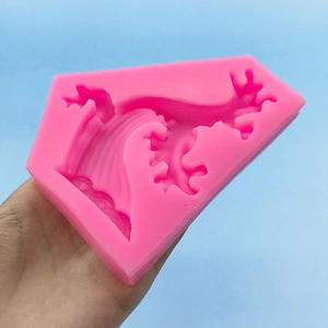 Pink silicone wave mold with intricate dragon pattern for DIY cake decorating