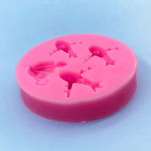 Pink silicone mold with 4 airplane shaped cavities for DIY cake decorating and chocolates