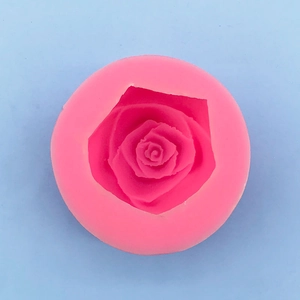 Macro top view of pink silicone rose mold showing detailed multi-layered 3D petals