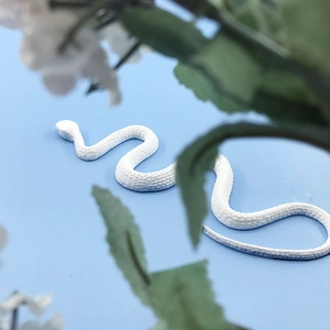 Detailed macro shot of white snake silicone mold featuring realistic scale texture and curves