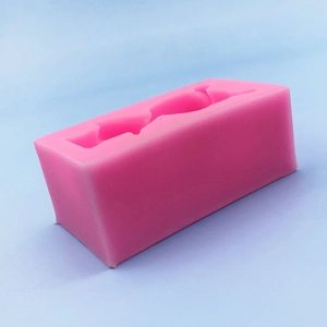 Pink silicone bear mold for chocolate and crafts shown from a 45-degree angle