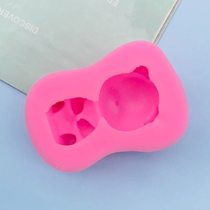 Detailed top view of pink silicone bear mold cavity for DIY chocolate and resin crafts