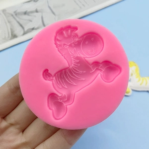 Pink silicone mold featuring a detailed running zebra for DIY cake and clay decor
