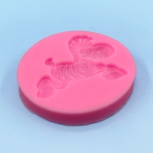 Pink silicone zebra mold for fondant cakes and DIY crafts in a circular shape