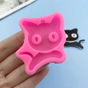 Cartoon cat silicone mold for fondant and resin pendants with hole on blue background