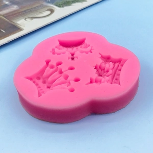 Pink silicone fondant mold featuring three different styles of royal crown shapes