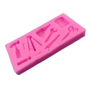 Pink silicone mold featuring hardware tools like hammer saw and ladder for fondant DIY
