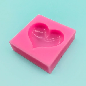 Pink heart-shaped silicone mold for DIY soap, chocolate, and candle making crafts