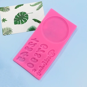 Pink silicone mold featuring Happy Birthday letters and 0-9 numbers for cake baking