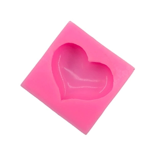 Pink heart-shaped silicone mold for DIY baking, chocolate, and soap making on white background