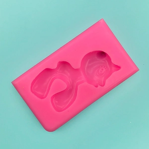 Macro detail of a flexible pink silicone pony mold for fondant and baking projects
