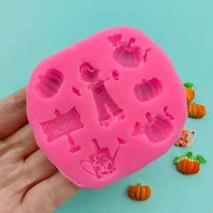 Pink silicone mold with pumpkin, scarecrow, and pumpkin patch signs for DIY baking