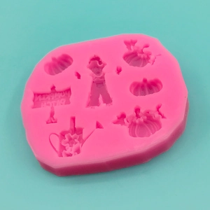 Halloween silicone mold featuring pumpkin scarecrow and watering can for cake decorating