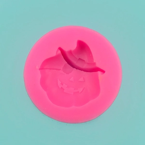 Pink silicone mold detail featuring a Jack-o'-lantern with a wizard hat for baking