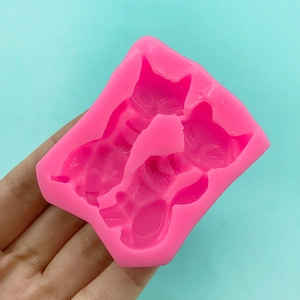 Pink silicone mold with three cat shapes for DIY crafts and cake decoration