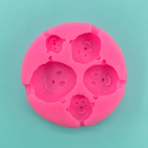 Pink silicone clown face mold with five circular cavities for DIY chocolate and fondant