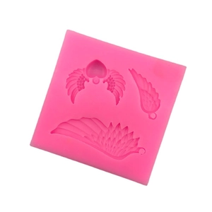 Pink silicone mold featuring three distinct angel wing shapes for DIY crafts and baking
