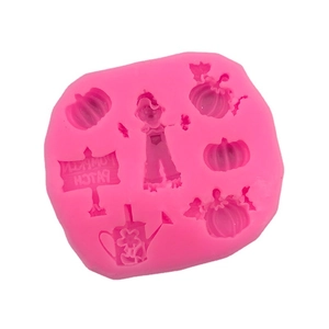 Pink silicone mold featuring pumpkin, scarecrow and watering can for Halloween DIY baking