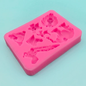 Hot pink silicone rectangle mold for DIY crafts with wing, heart, and flower shapes