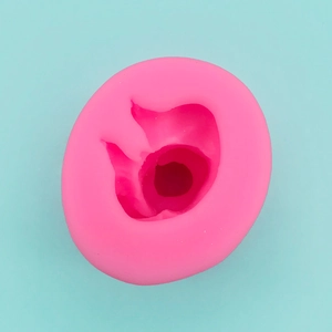 Detailed top view of pink silicone mold for 3D baby shapes and DIY soap making