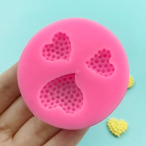 Pink silicone heart mold with three cavities and unique honeycomb texture for DIY chocolate