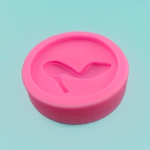 Pink circular silicone mold with 3D high heel shoe design for cake and resin crafts
