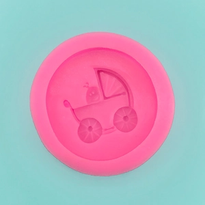 Detailed macro view of the baby stroller pattern inside the pink silicone fondant mold